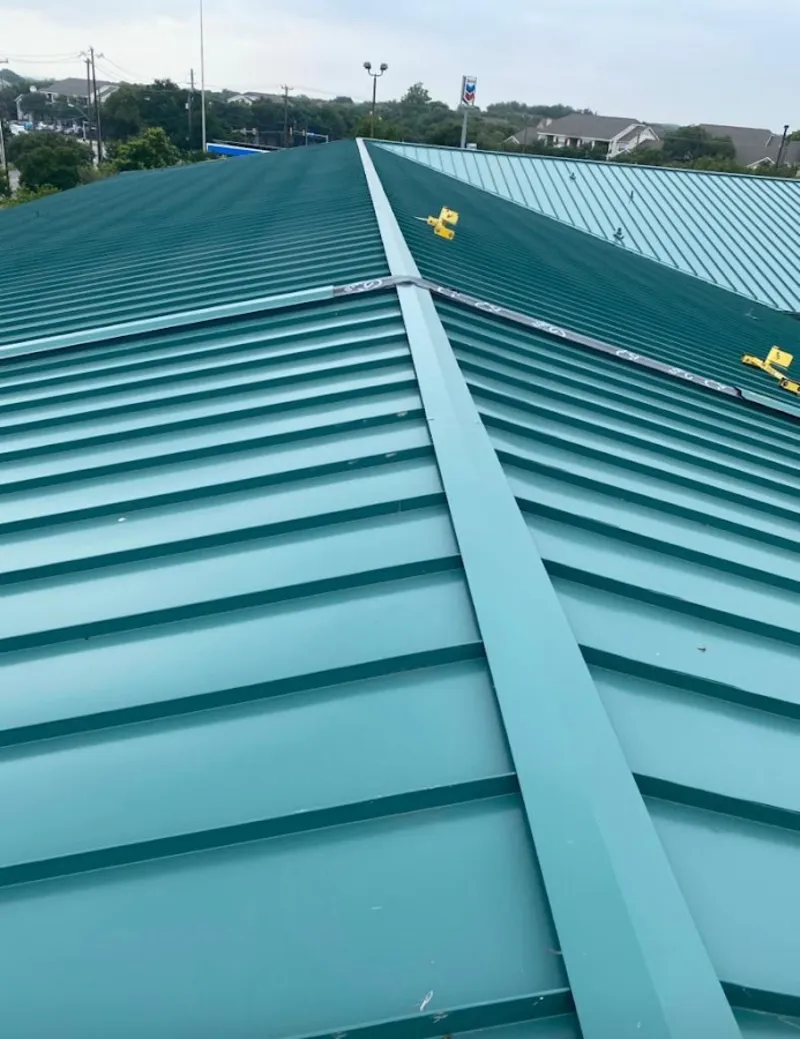 Green commercial metal roof ridge and valley for Metal Roof Repair in Oberlin